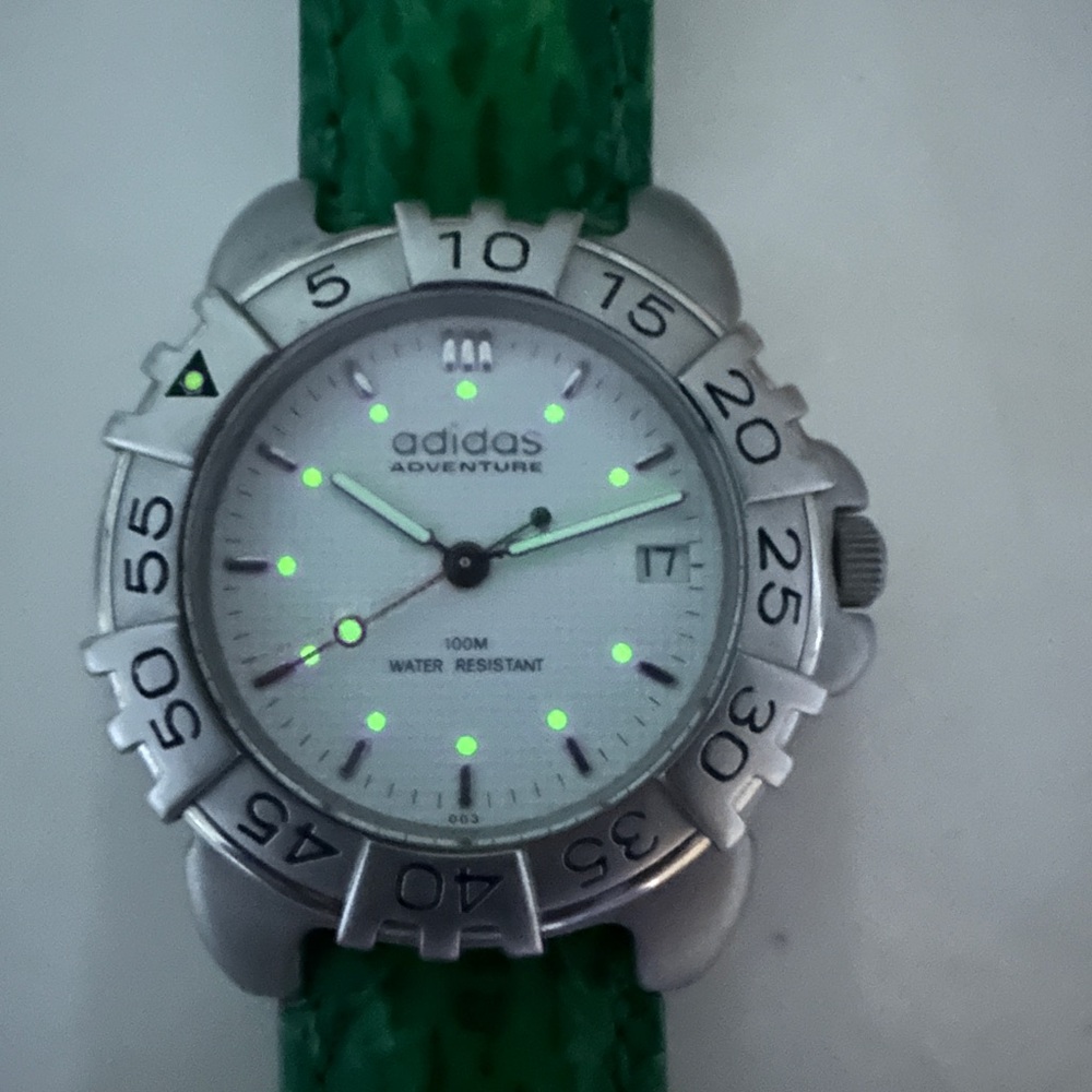 Adidas Adventure Silver Dial with Green Strap excellent condition.NewBattery.